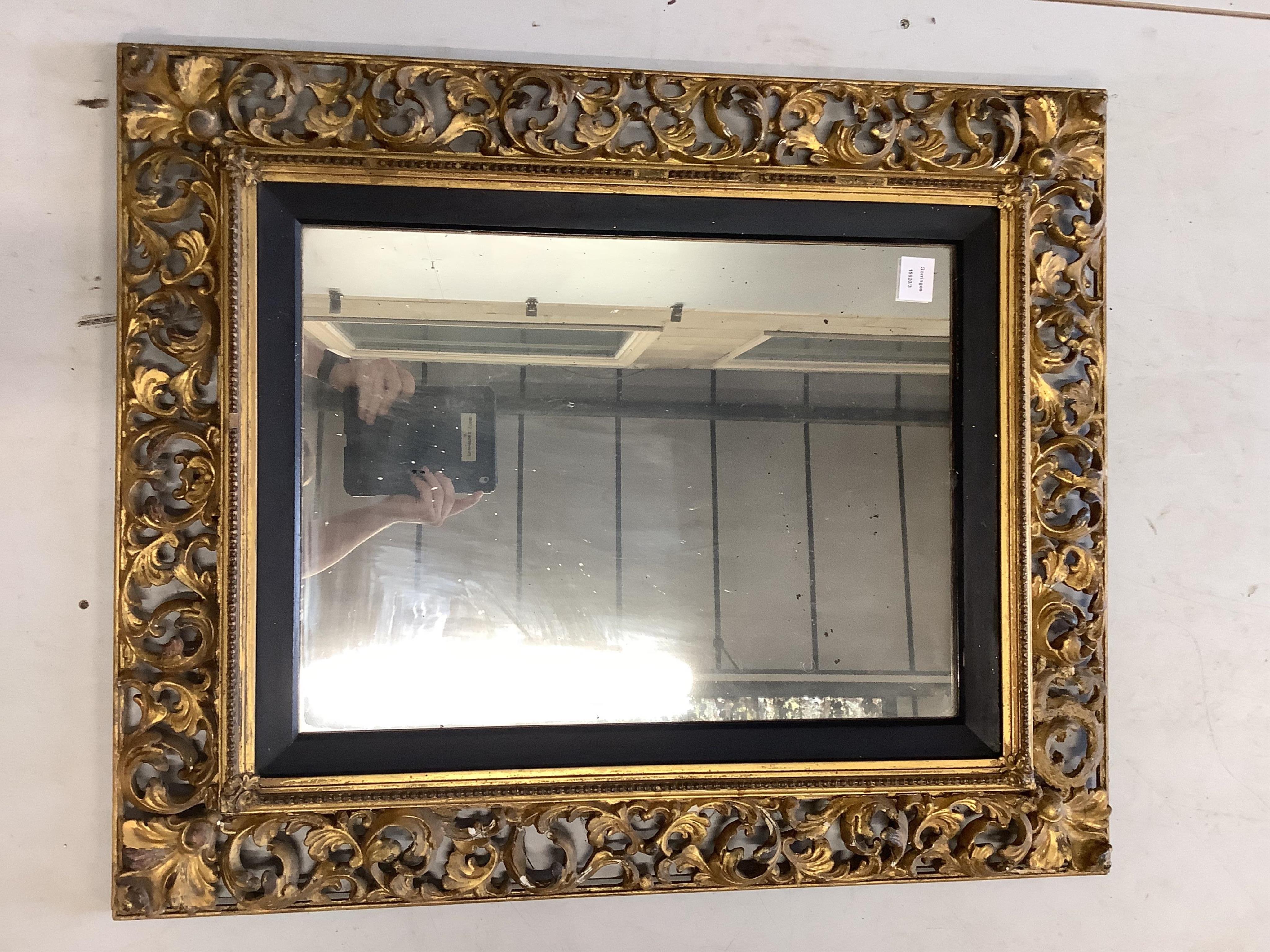 A Florentine style rectangular giltwood and composition wall mirror, width 74cm, height 90cm. Condition - fair